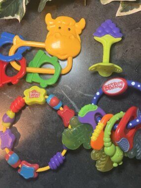 Set of 4 Baby Rattles & Teethers - Cow w/Bells , Nuby Keys, Bright star, grapes